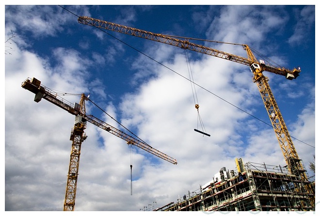 2 cranes on construction site