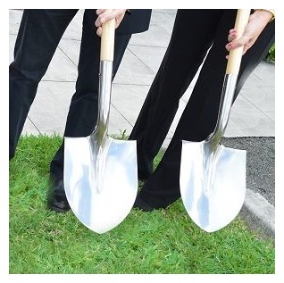 groundbreaking shovels on grass