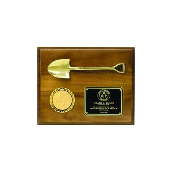 wall plaque with small brass shovel company logo on gold color medallion and engraved plate