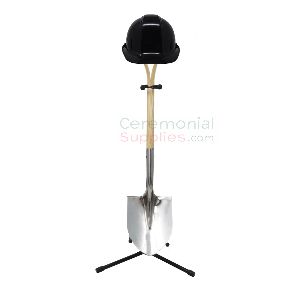 shovel with hard hat on stand