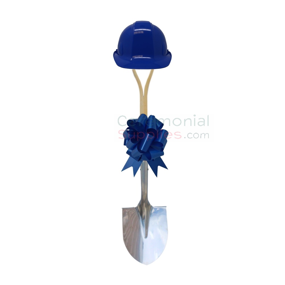 shovel with blue hard hat on a stand with blue large bow on handle