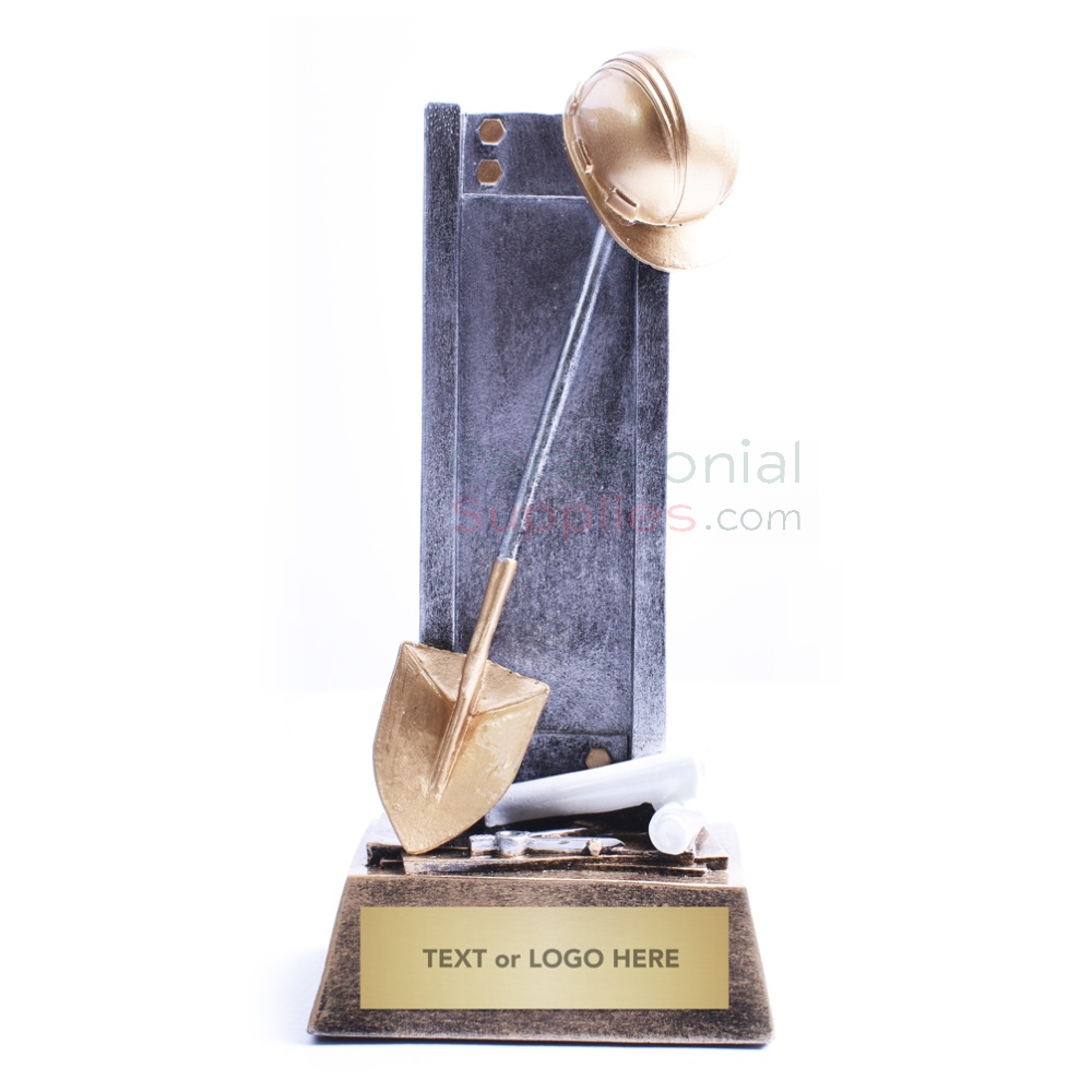 desk trophy of miniature shovel and concrete slab