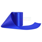 Unrolled spool of plain grand opening ribbon in royal blue .