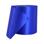 Rolled up spool of plain royal blue ceremonial grand opening ribbon.