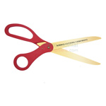 Red pre-printed ribbon cutting ceremony golden blade scissors showing text.