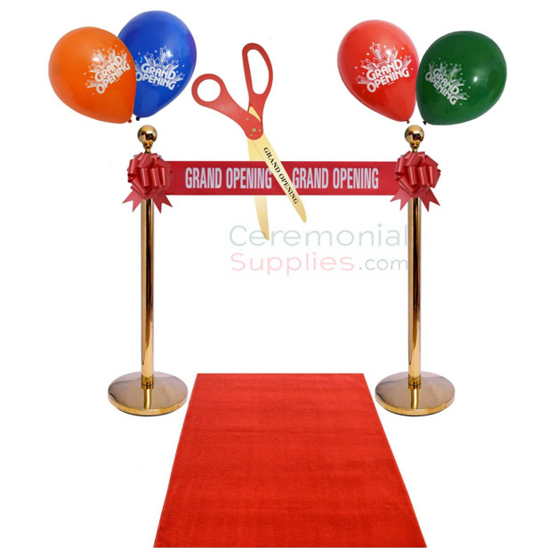 grand opening ribbon with stanchions and carpet