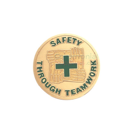 Front view image of the Safety Through Teamwork medal which presents four hands holding each other surrounding a green cross in the center.