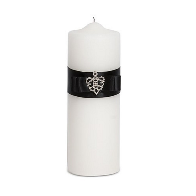 Image of a unity candle wrapped in a satin ribbon with a crowned jewel in the center. 