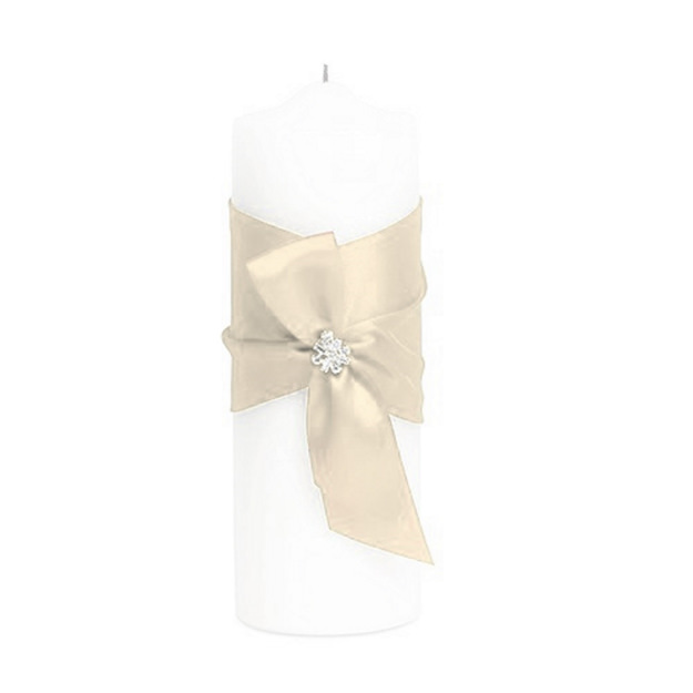 Picture of candle wrapped in an ivory ribbon with a jewel adornment on the center. 