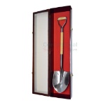 Groundbreaking shovel display case with glass door open.