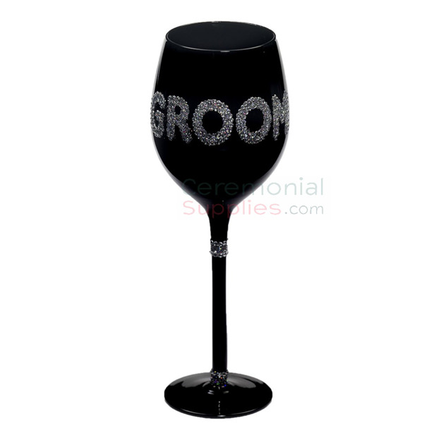 Photo of the Groom wine glasses in decorative embellishments.