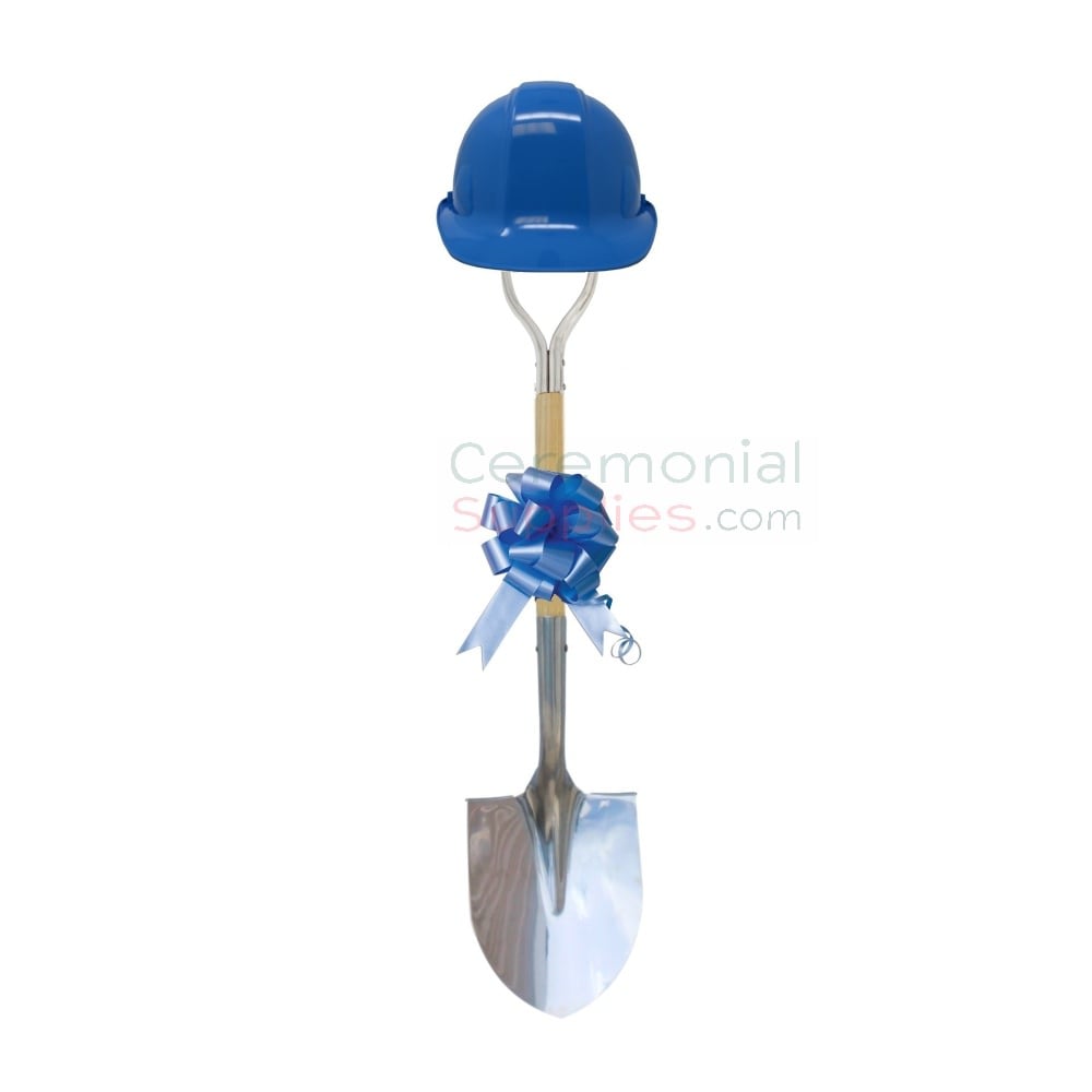 light blue groundbreaking shovel with matching hard hat and bow