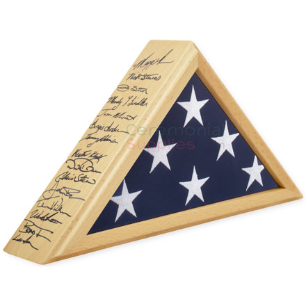Triangle flag display case with light wood and handwriting on the side