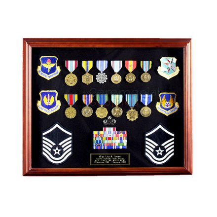 Picture of cherry finish display case full of medals