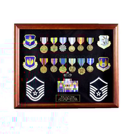 Picture of cherry finish display case full of medals