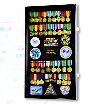 Large vertical display case filled with medals