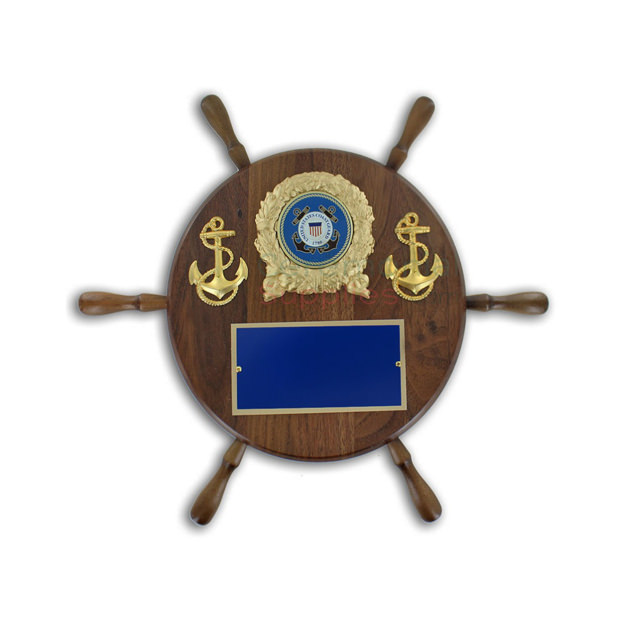 Pictured wheel shaped award plaque with two anchors, the Coast Guard emblem, and an engraving plate