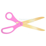 Image of golden blade scissors with pink handles.