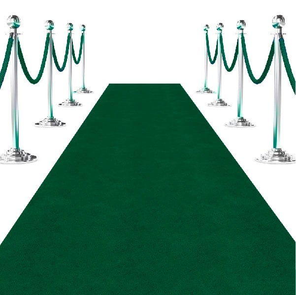 green carpet runner flanked by chrome stanchions and green velvet rope