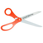 Picture of ceremonial scissors with custom logo sample and orange handles.