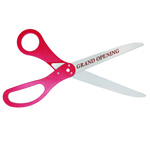 Image of ceremonial scissors with custom logo sample and red handles.