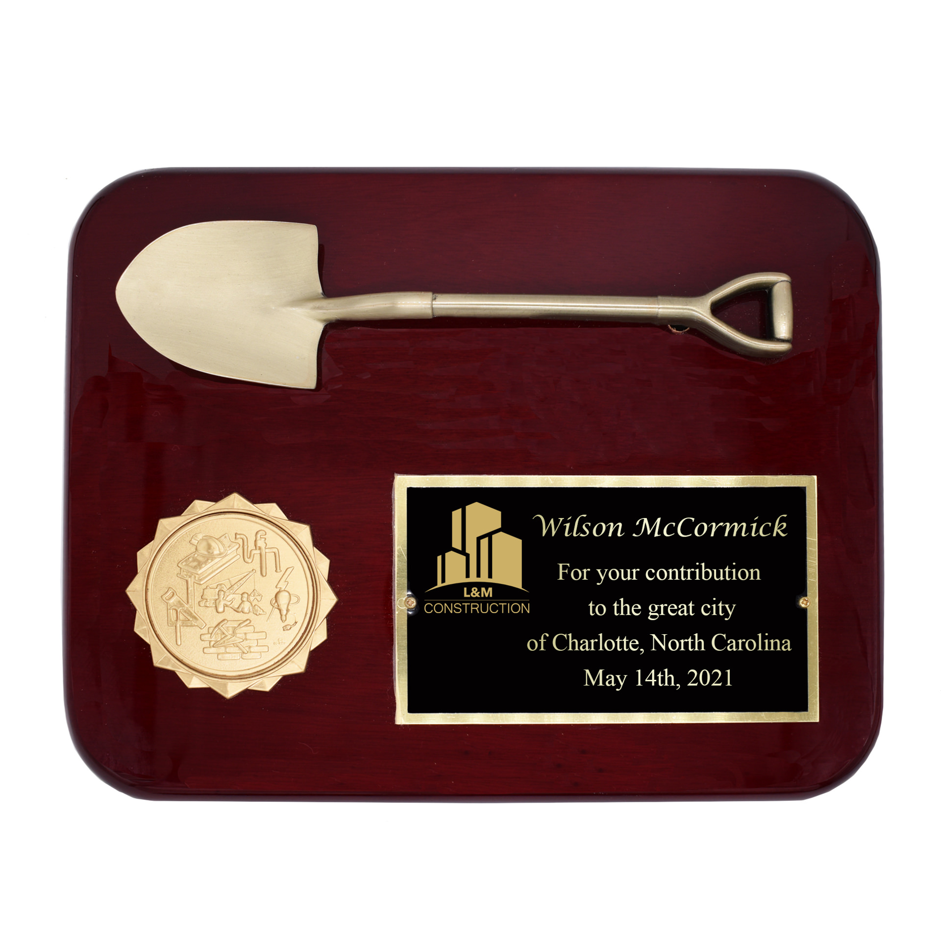 plaque with mini construction shovel and engraved text