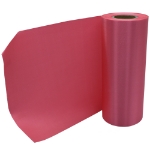 Rolled up view of hot pink plain grand opening ribbon.