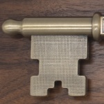 Walnut Key to the City Plaque with Ornate Key Zoomed in